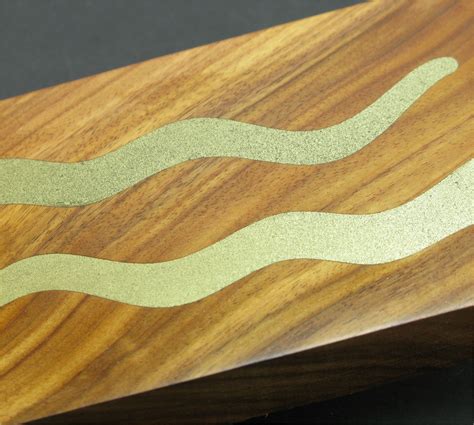 inlay metal bracket into redwood|how to inlay metal powder in wood.